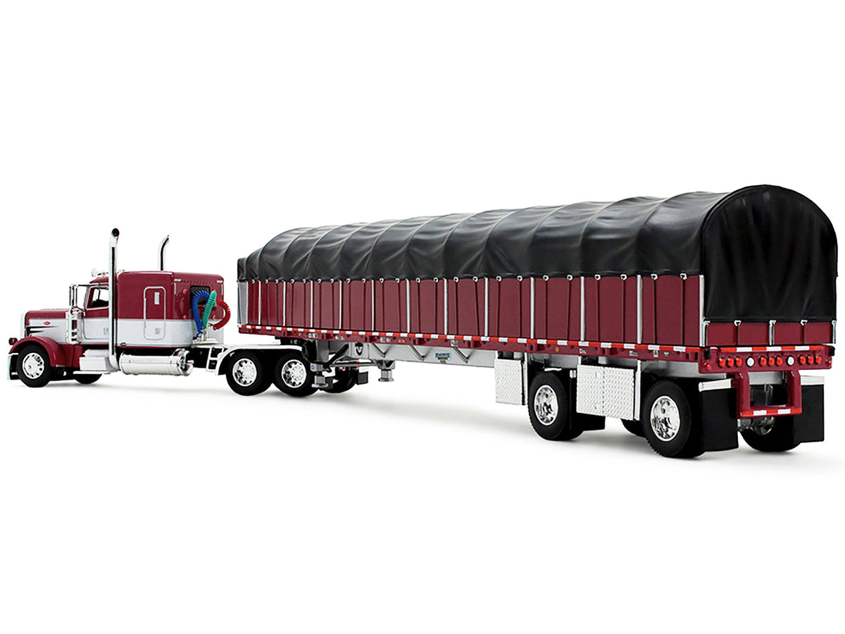 Peterbilt 389 with 63" Flat Top Sleeper and 53' Wilson Roadbrute Flatbed Trailer with Covered Wagon Maroon with White Stripes 1/64 Diecast Model by DCP/First Gear