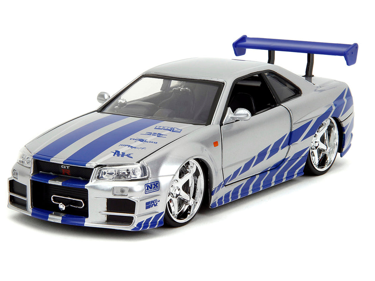 Brian's Nissan Skyline GT-R (R34) Silver Metallic with Blue Stripes and Suki's Honda S2000 Pink with Graphics Set of 2 Cars "Fast & Furious 25th Anniversary" "Fast & Furious" Series 1/24 Diecast Model Cars by Jada